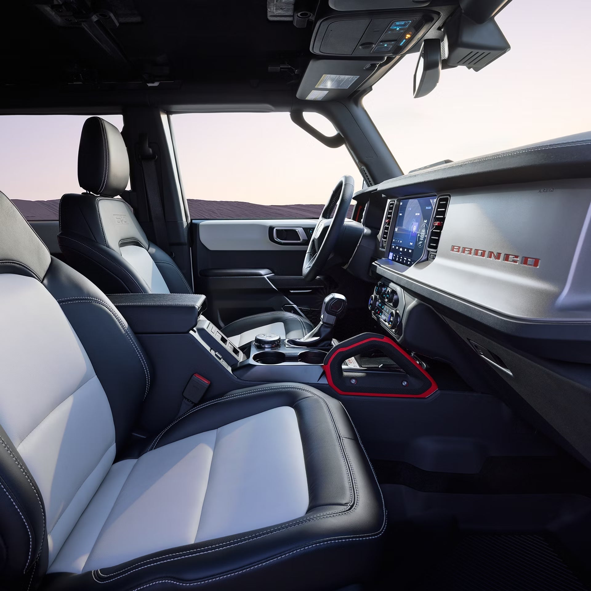 The silver interior of the 2026 Ford Bronco Sport in Phoenix is seen from the passenger's window looking towards the driver's seat.